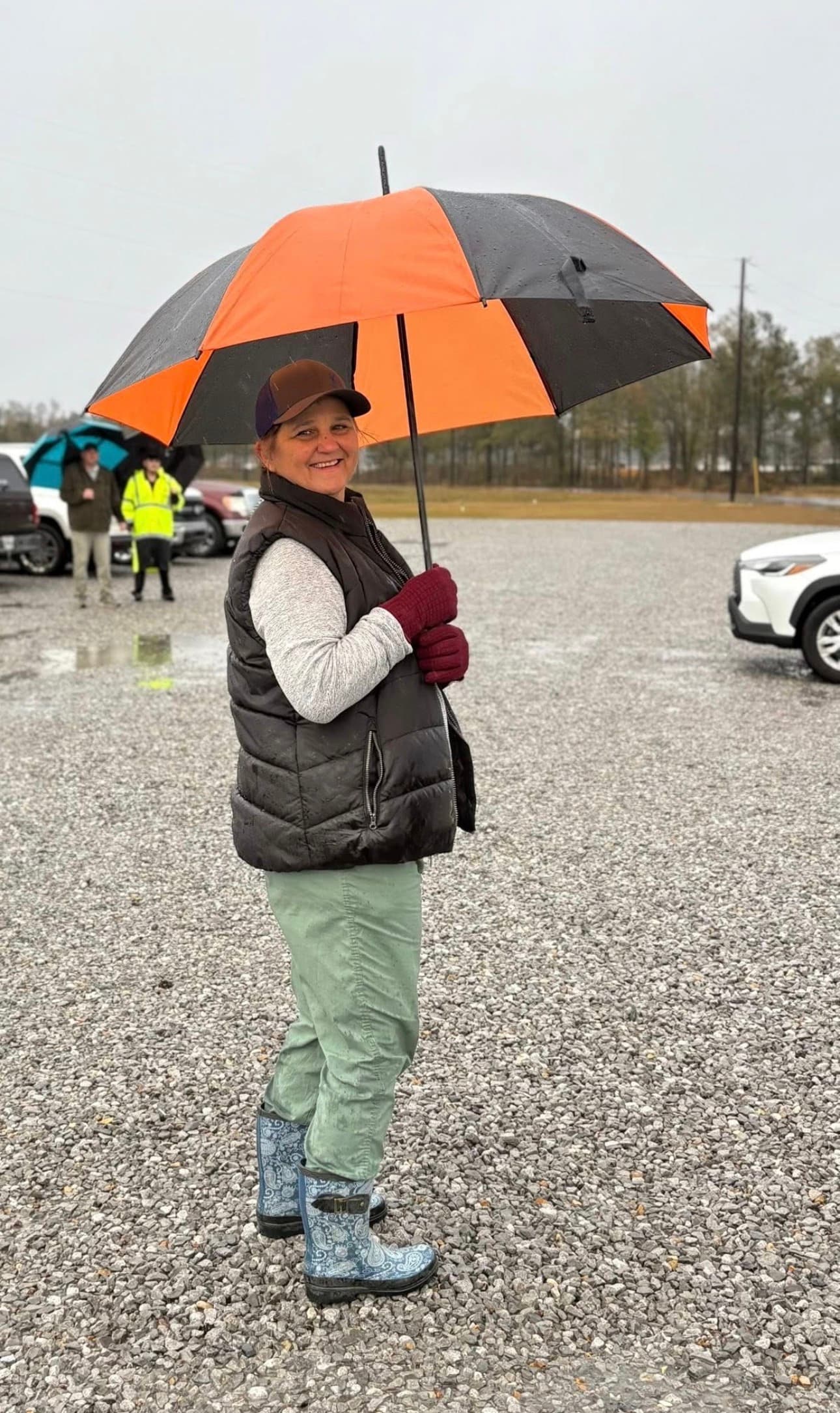Reggie and Jennie serving on the parking team in the rain